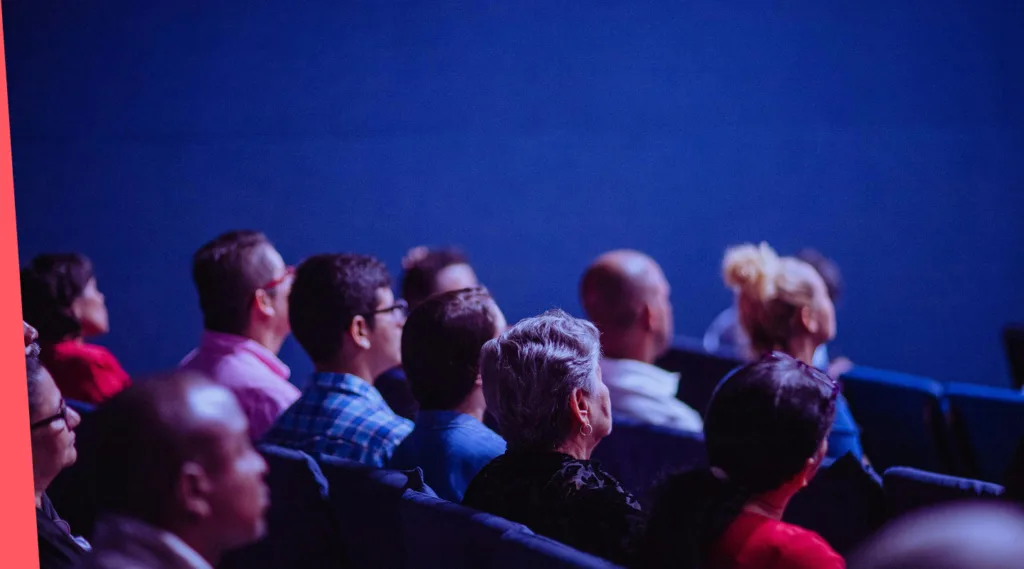Audience watching a presentation or performance.