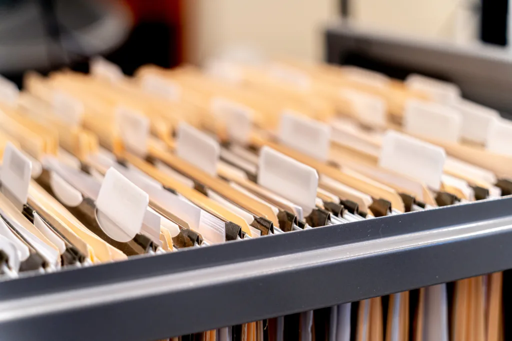 Hanging files in filling cabinet in an office workplace